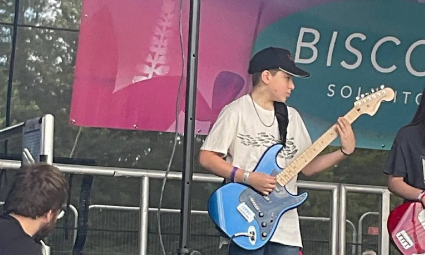 Image shows Swanmore College pupils performing on stage with their band at SwanFest 2024